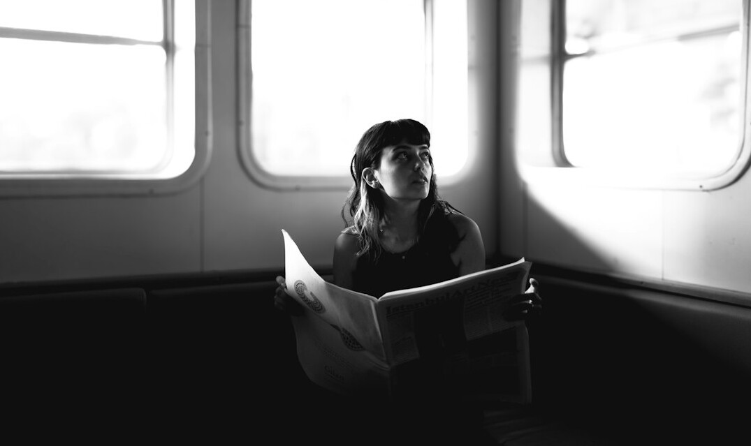 woman reading documents thoughtfully