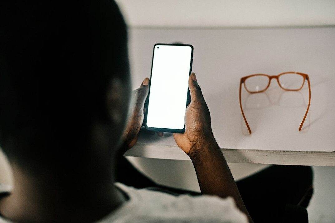 person checking phone secretly