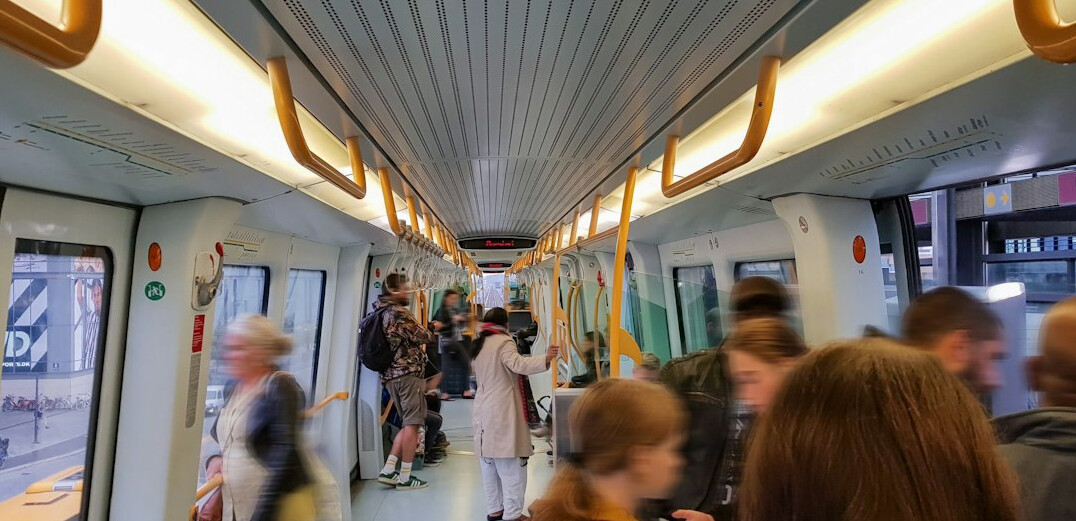 Crowded tram interior during rush hour